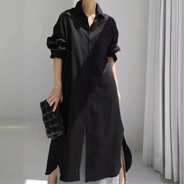Elegant women's collared roll-sleeve midi dress, featuring practical pockets and a flowing silhouette.