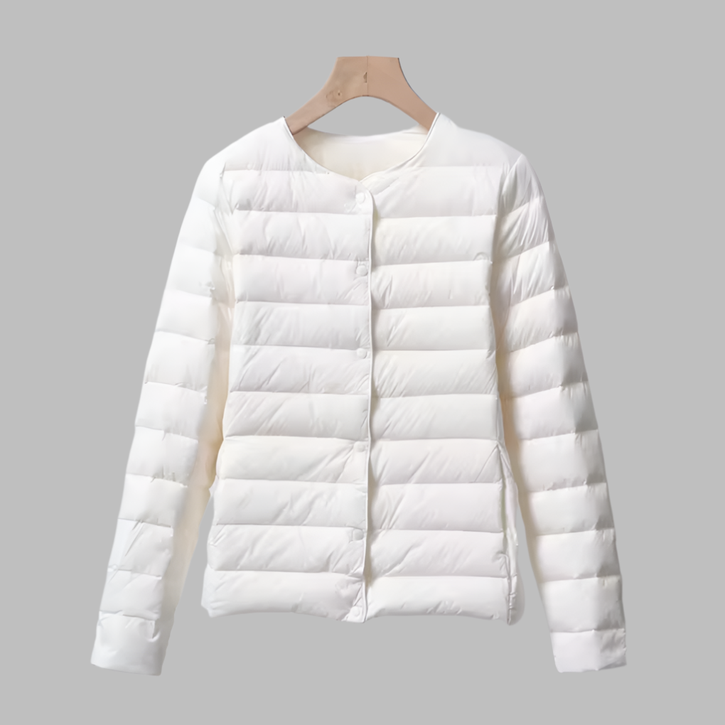 Packable women's ultralight puffer jacket, collarless design in navy, ideal for travel and spring outerwear.