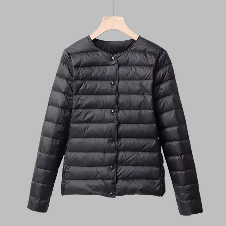 Warm women's ultralight zip-up puffer jacket with collarless neckline, great for winter layering or casual wear.