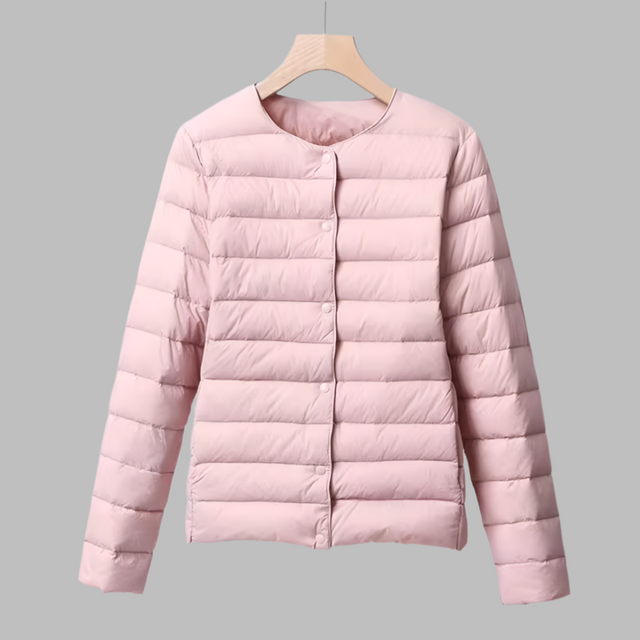 Outdoor-ready women's collarless ultralight puffer, a warm and packable jacket designed for active comfort.