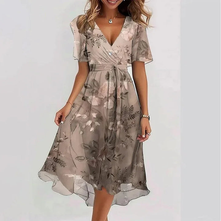 Fashionable women's floral midi A-line dress with V-neck, short sleeves, perfect for a relaxed summer day.