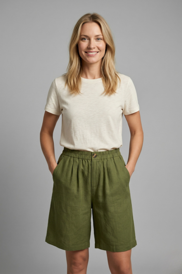 Relaxed fit women's mid-length shorts with elastic drawstring waist and practical side pockets.