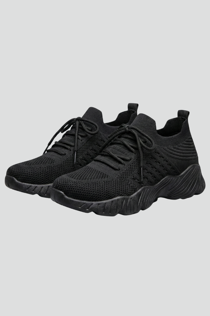 Women's comfort knit sneakers with secure lace-up closure for casual or athletic wear.