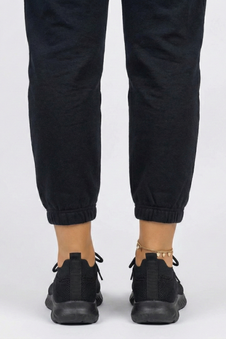 Sporty women's knit sneakers with secure laces, a low profile, & cushioned sole for active comfort.