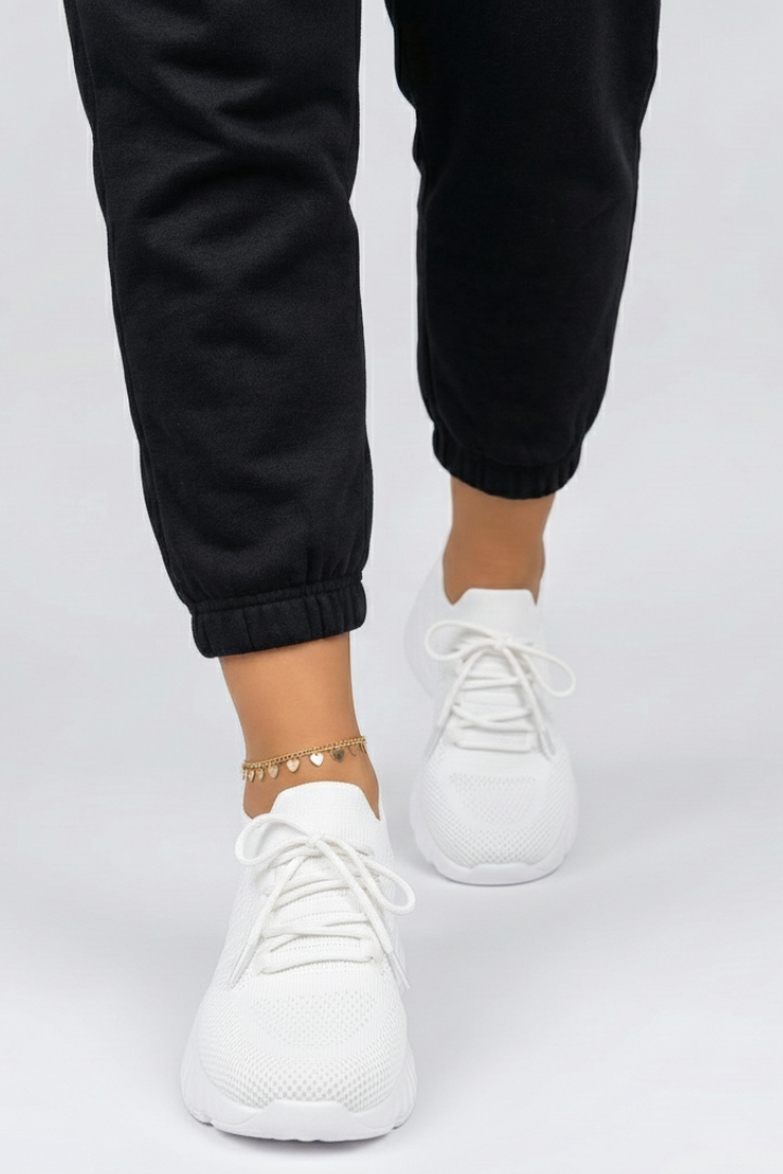 Breathable knit women's comfort shoes with secure laces, offering a flexible fit for everyday footwear.