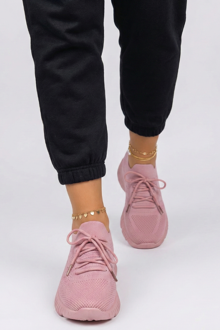 Textured sole women's knit sneakers with secure laces, crafted for cushioned comfort and durable wear.