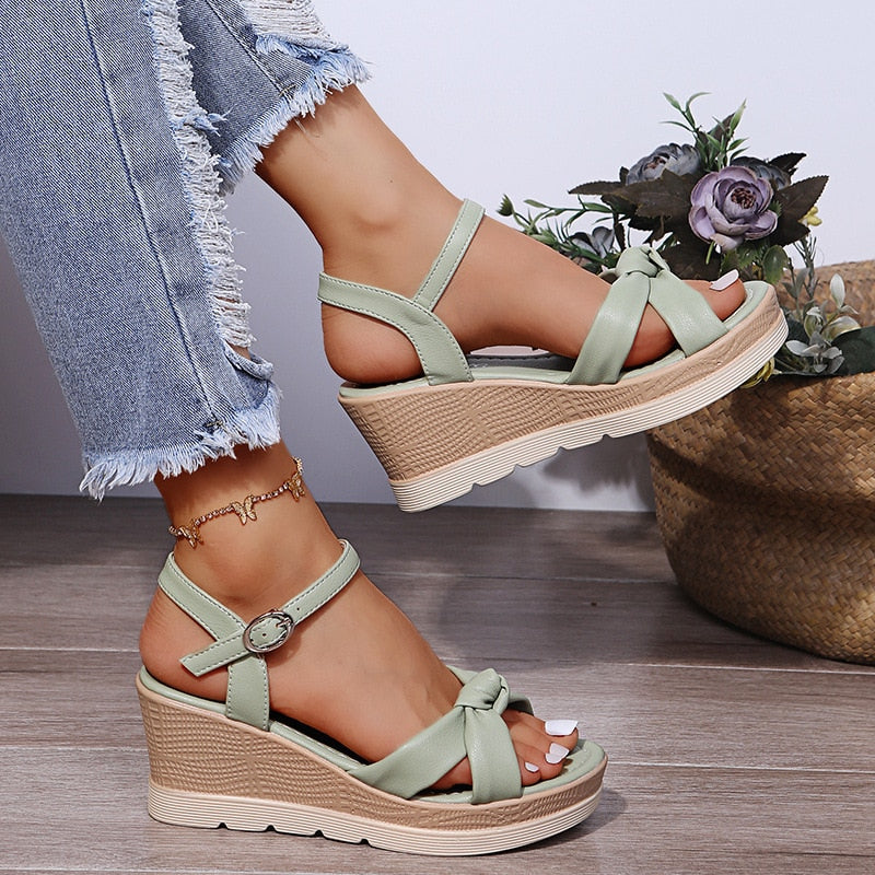 Women's casual platform wedge sandals with comfortable sole, secure ankle strap, and versatile summer design.