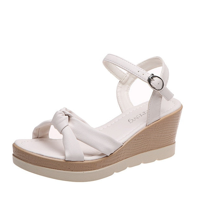 Chic women's comfort platform sandals with a wedge heel, ankle strap, and open-toe design for daily use.