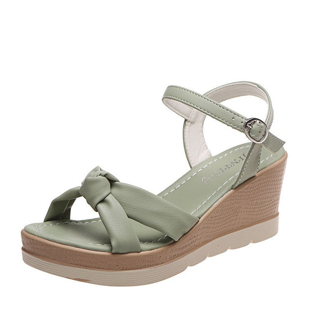 Soft women's platform wedge sandals with an ankle strap, offering ultimate comfort for summer and everyday wear.