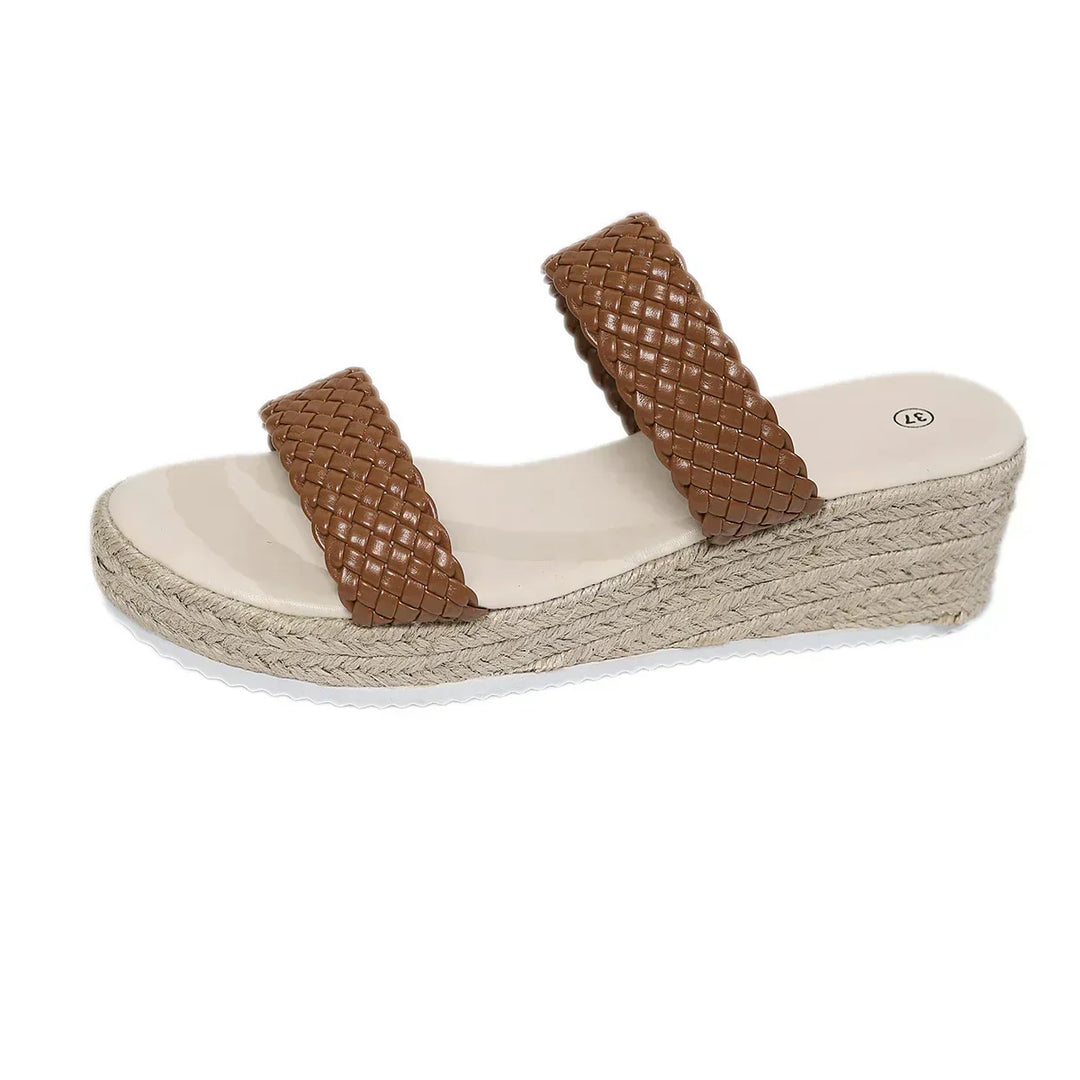 Comfortable women's wedge sandals with soft cushioning, ideal for all-day walking. Stylish summer footwear.