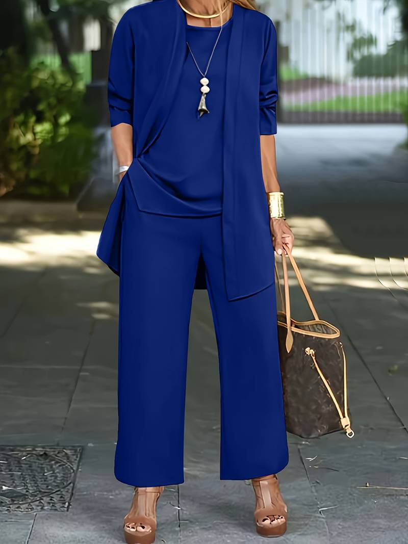 Comfortable women's 3 piece lounge wear set in a solid color, with long sleeves, round neck top, and wide leg pants.