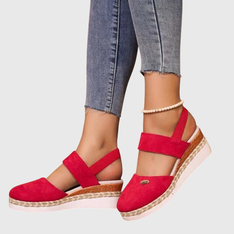Beaded flat women's boho sandals with comfortable elastic ankle strap, great for sunny days.