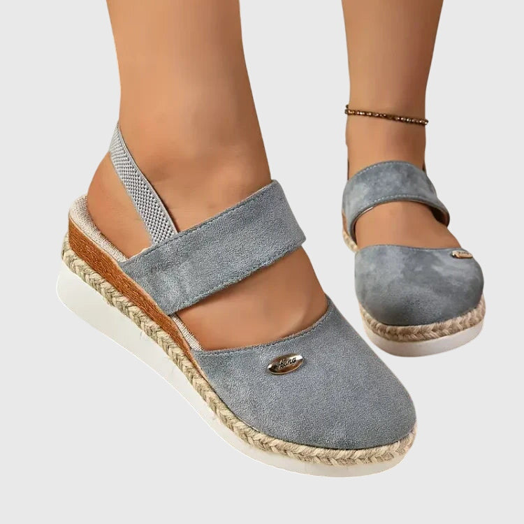 Beaded women's summer sandals, comfortable flat design with secure elastic strap for casual wear.