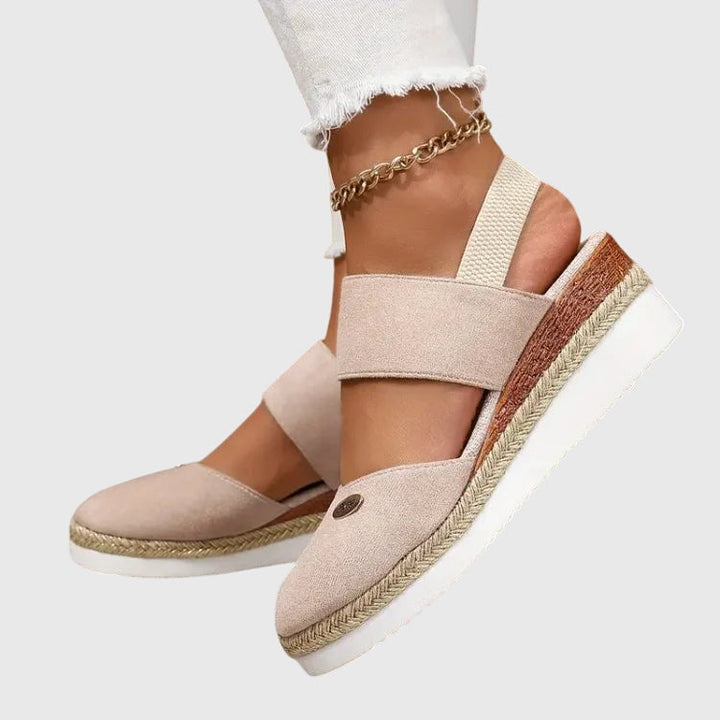 Fashionable women's warm weather sandals, beaded, comfortable, with an elastic ankle strap.