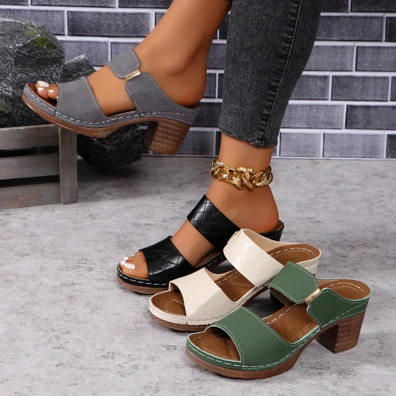Stylish women's leather block heel sandals, perfect comfortable footwear for casual or elegant wear.