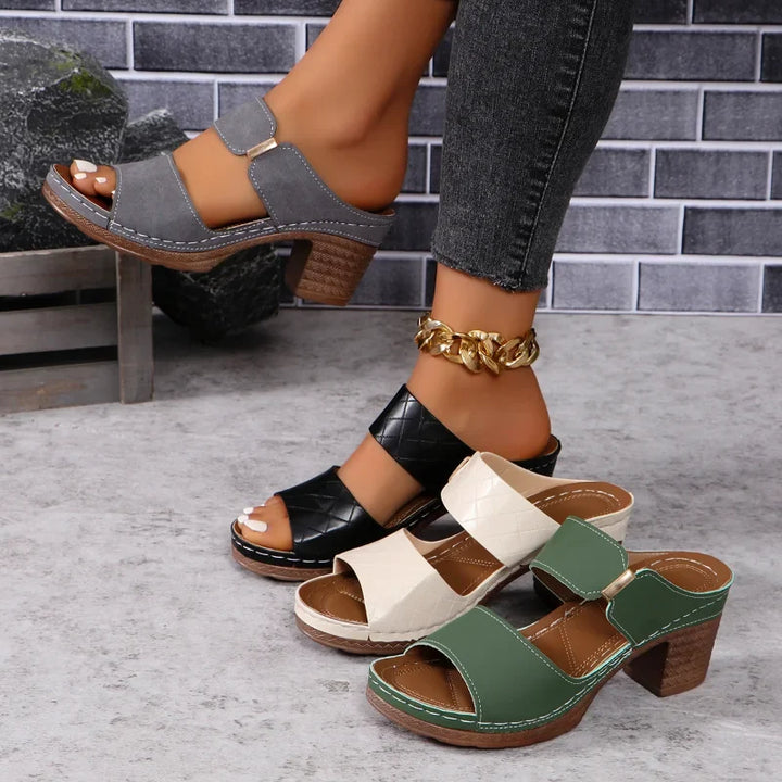 Stylish women's leather block heel sandals, perfect comfortable footwear for casual or elegant wear.