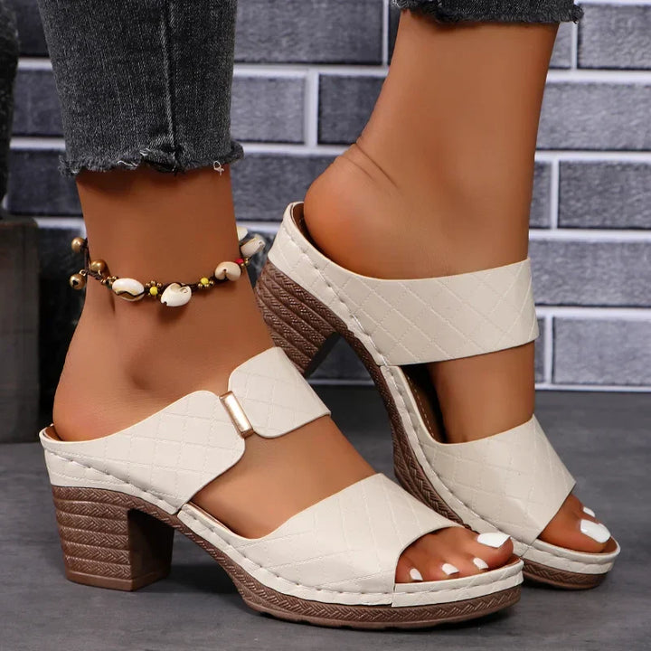 Women's comfortable leather block heel sandals, versatile and chic slip-on style for modern fashion.