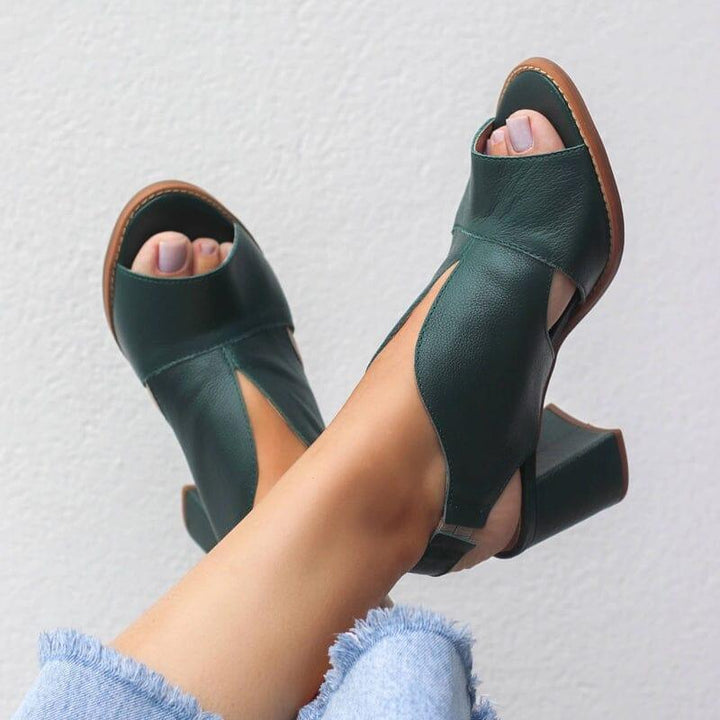 Detailed view of women's versatile block heel sandals, showing stylish buckle closure.