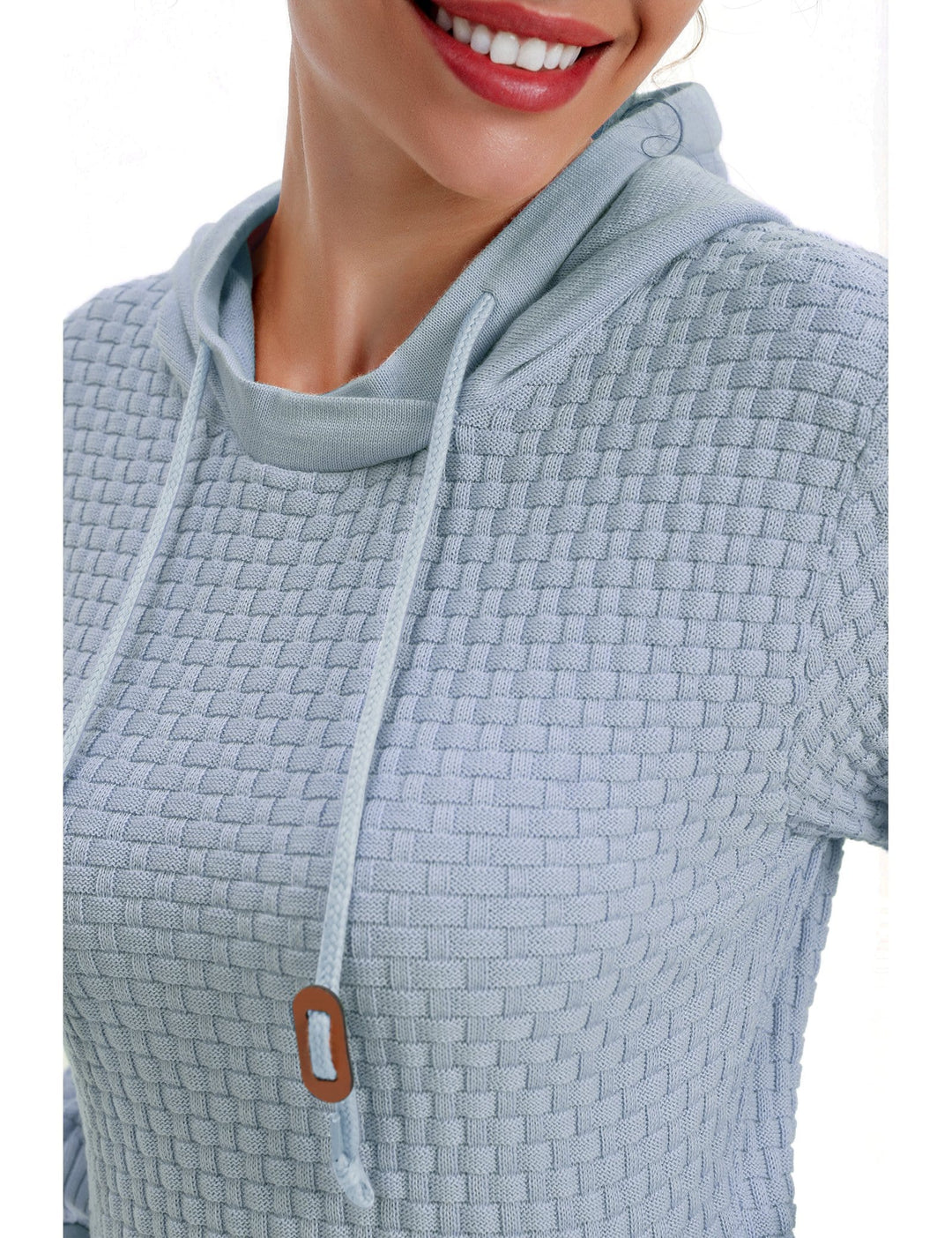 Dynamic shot of a woman moving while wearing a breathable hoodie, showing flexibility.