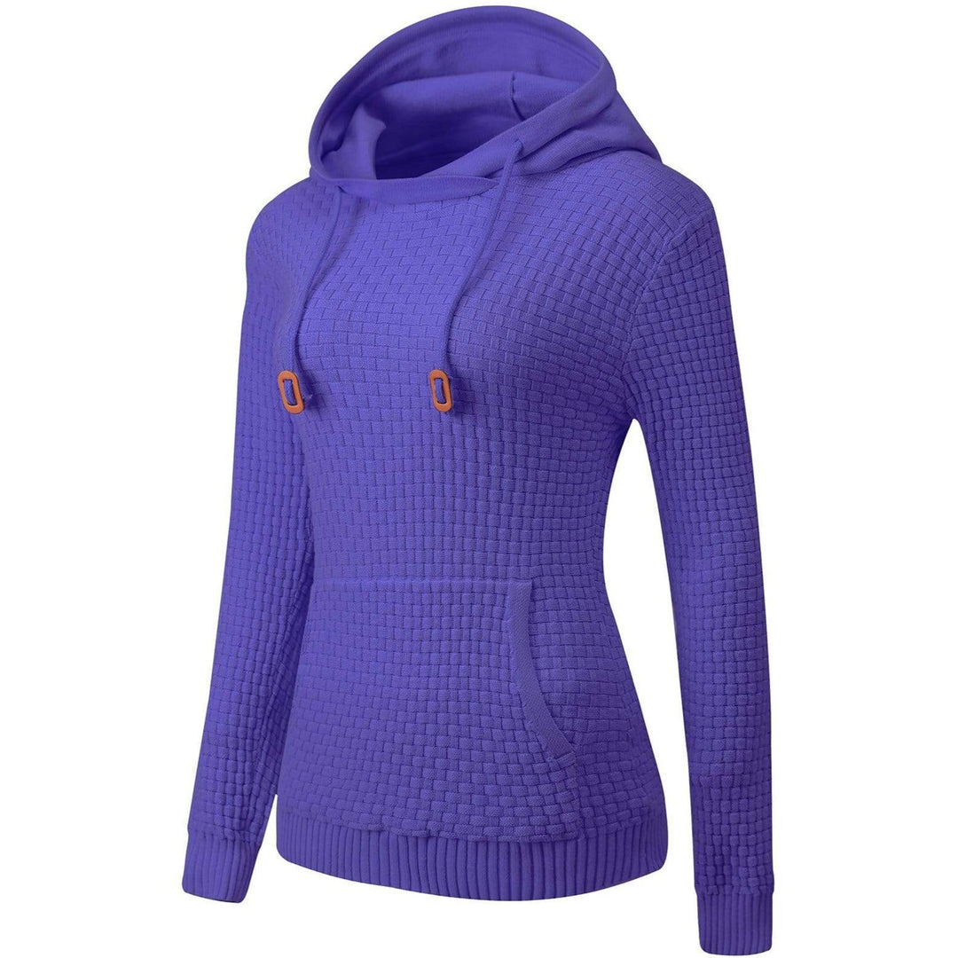Close-up of the breathable cotton blend fabric of a women's pullover hoodie, soft texture.