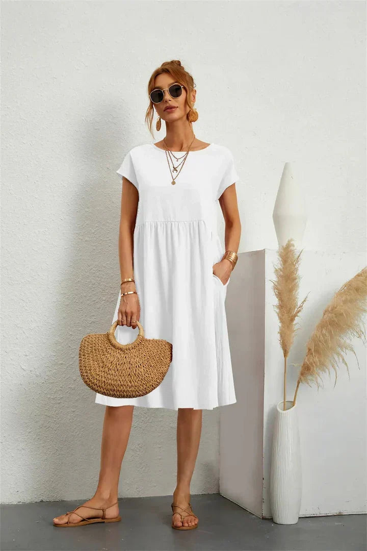 Modern comfortable women's midi dress with pockets, perfect for a chic relaxed casual look.