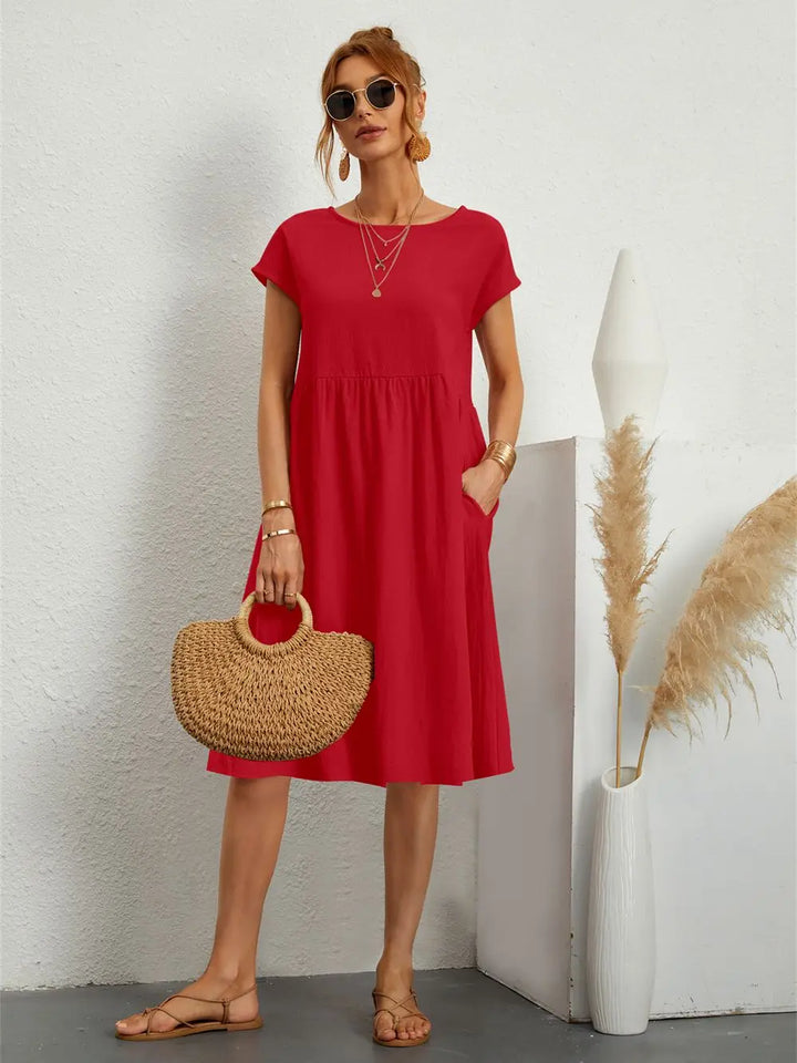 Stylish women's casual midi dress with practical pockets, ensuring comfort for any day.