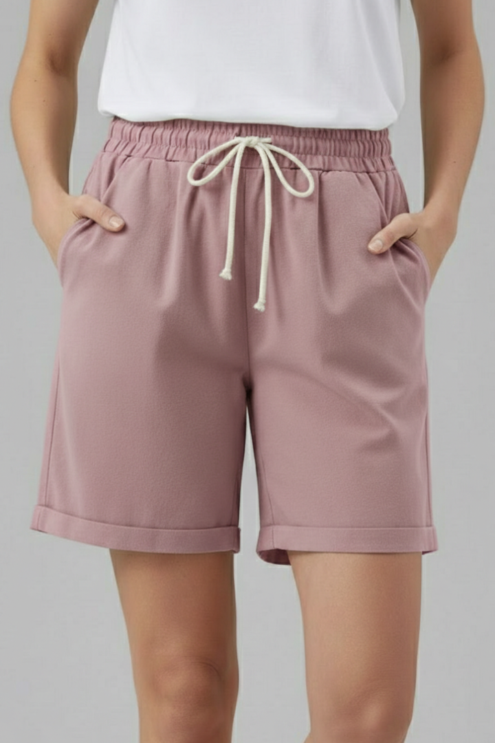 Detail shot of the cuffed hem and side pockets on women's comfortable summer shorts.