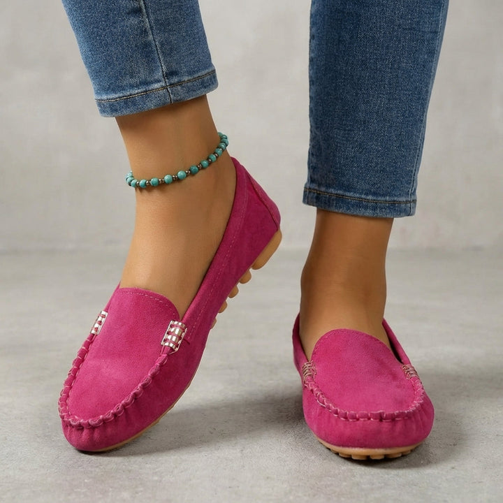 Stylish women's slip-on loafers featuring metallic accent & orthopedic support for comfort.