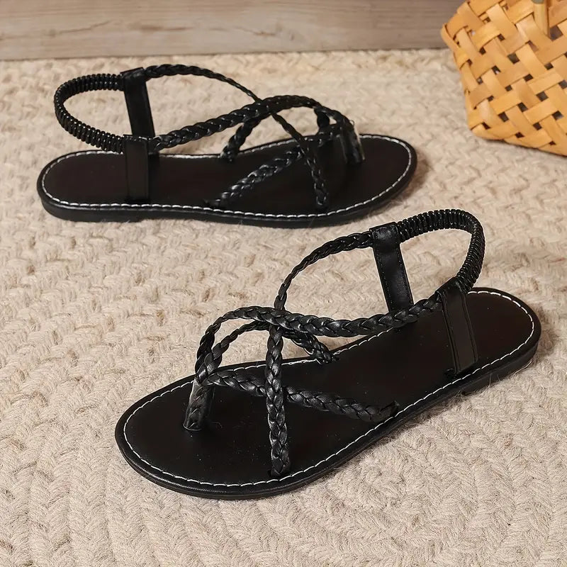 Minimalist women's flat sandals with sleek elastic straps, a comfortable and stylish choice for summer fashion.