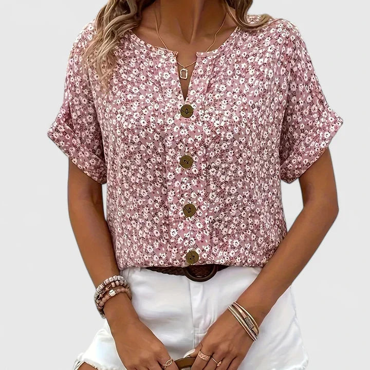 Vibrant floral button-up blouse for women, soft fabric, ideal spring & summer fashion. Elegant casual top.