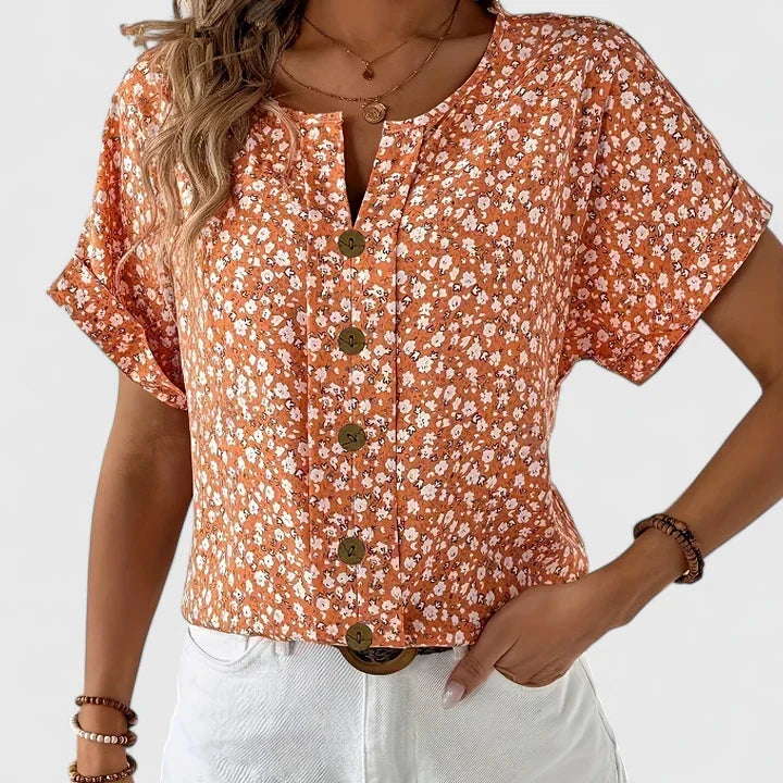 Elegant floral button-up blouse for women, versatile comfortable top, great for casual or dressier looks.