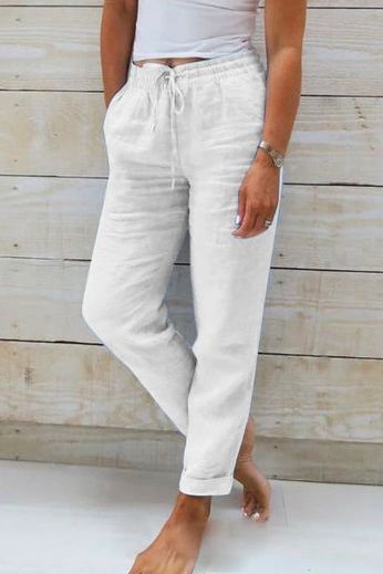 Woman walking in comfortable wide leg flowy pants, showcasing their relaxed fit and stylish casual wear.