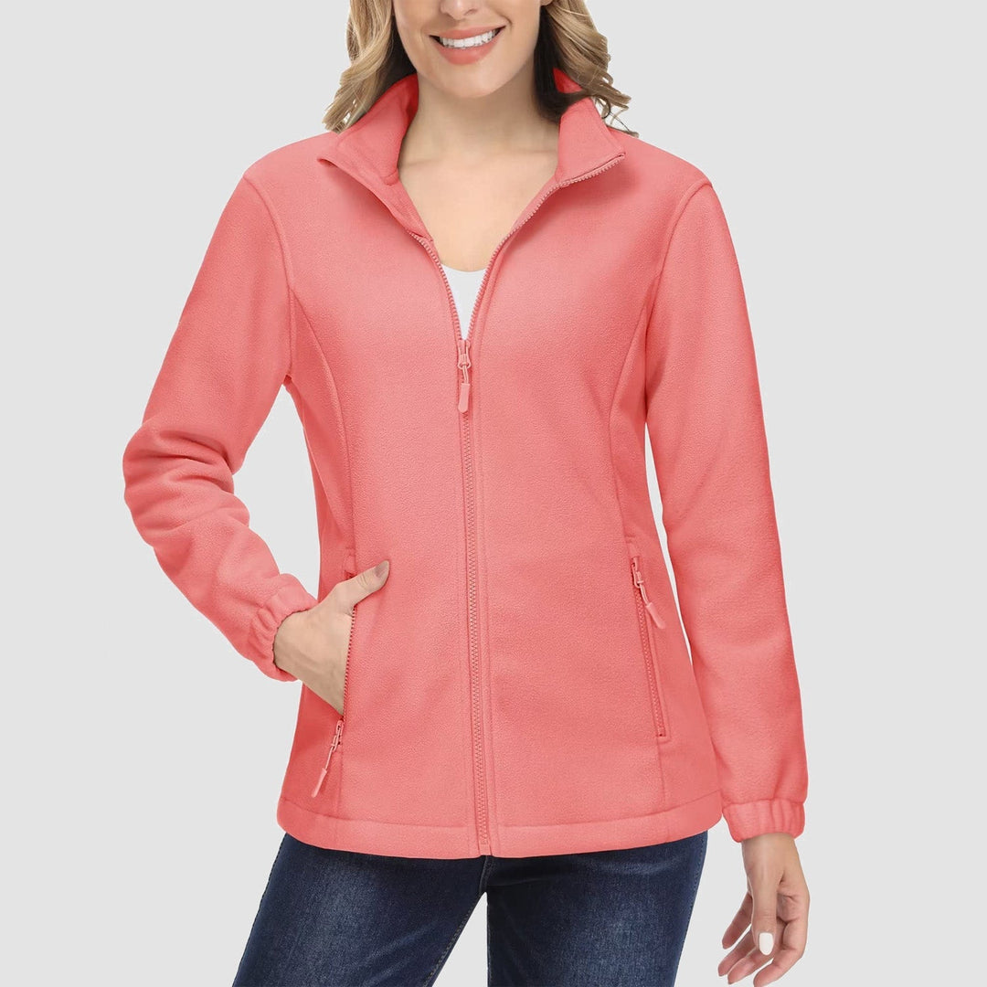 Woman carrying a dog, wearing a practical gray full-zip fleece jacket, great casual outerwear