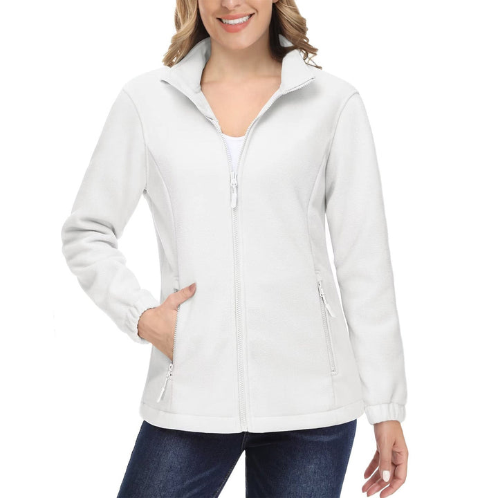 Woman traveling, wearing a lightweight but warm full-zip fleece jacket, essential outerwear