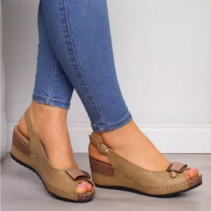 Stylish women's low wedge peep toe slingback sandals with adjustable strap for warm weather comfort.