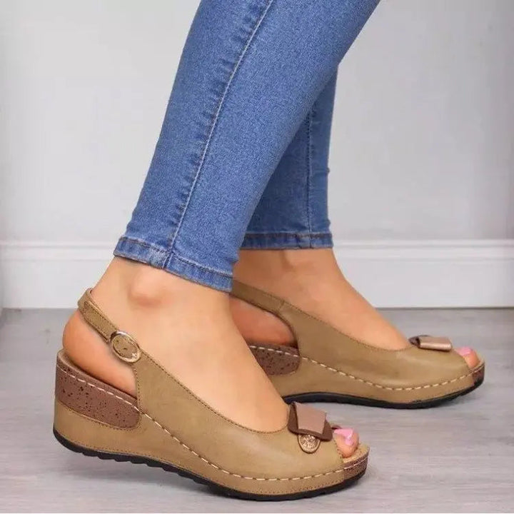 Casual women's peep toe wedge sandals featuring a comfortable low heel and secure slingback strap.