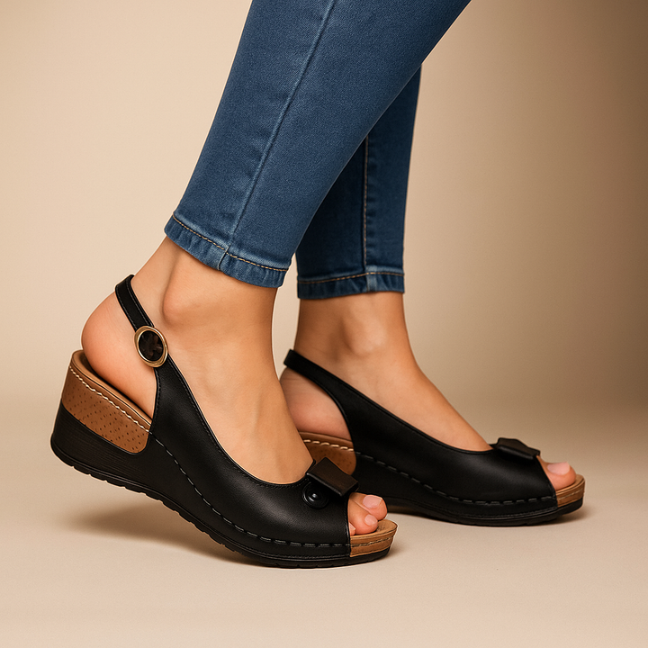 Women's comfortable low wedge slingback sandals with a peep toe and adjustable strap for all-day summer wear.
