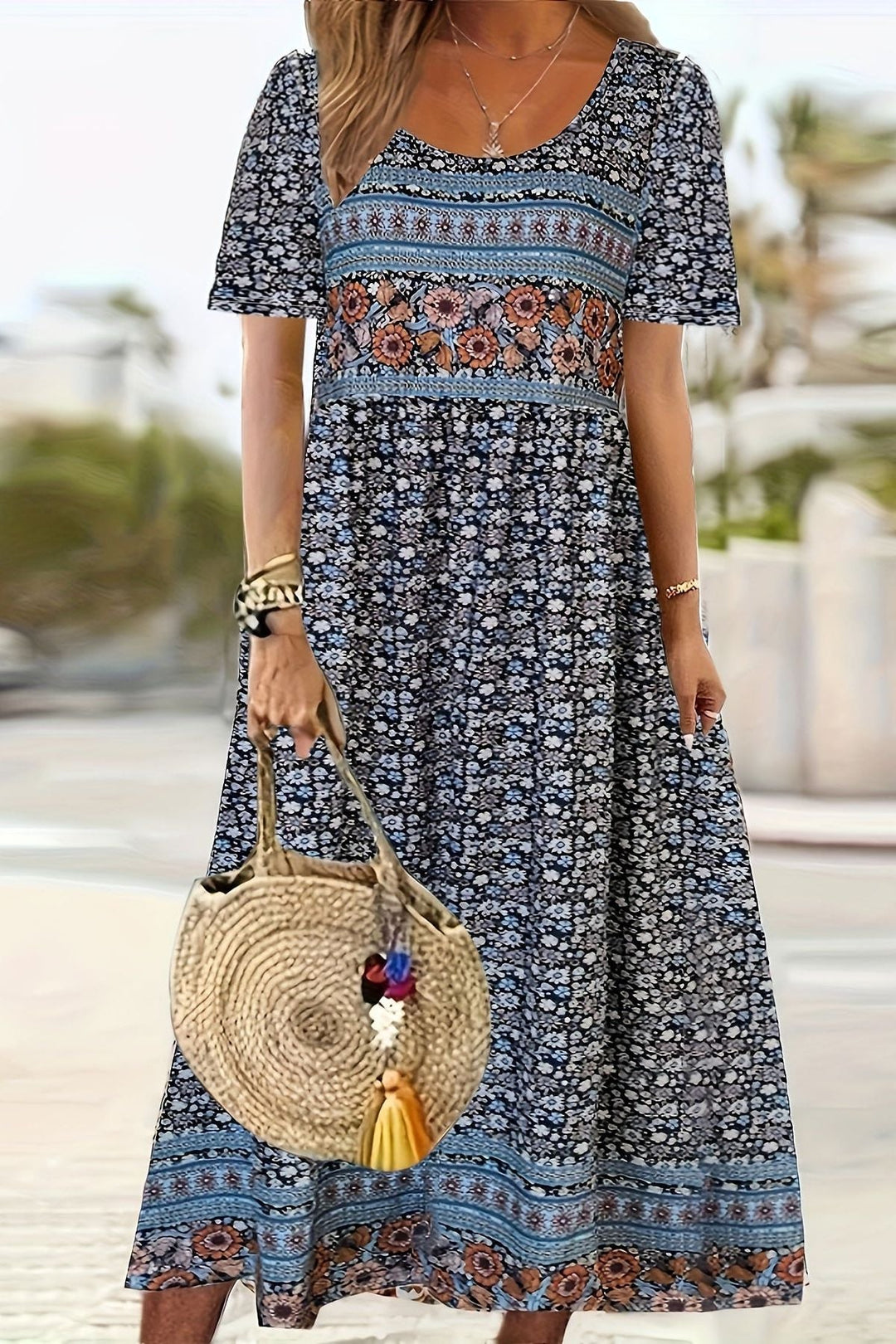 Elegant women's knee-length printed midi dress. Comfortable relaxed fit, perfect for versatile spring & summer casual wear.