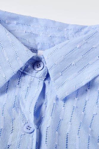 Elegant yet casual women's shirt and short set, the perfect summer outfit for comfort.