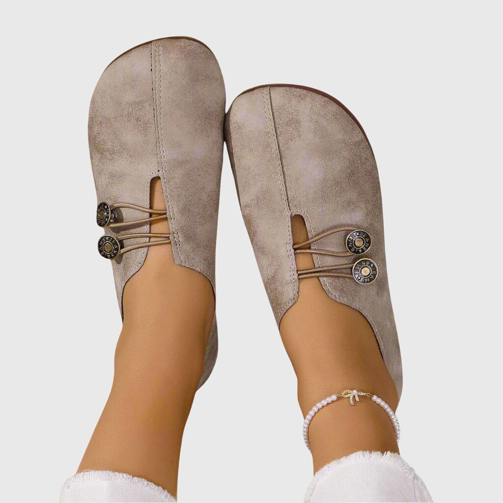 Stylish women's slip-on flat shoes with toggle lace, offering easy wear and flexible barefoot comfort.