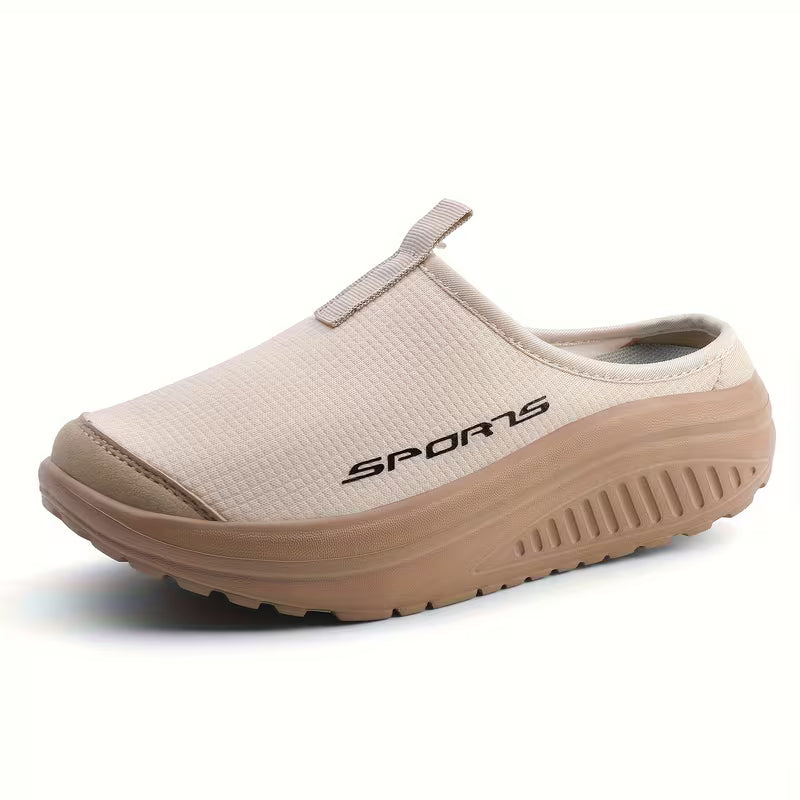 Women's comfortable slip-on orthopedic slippers with arch support for indoor comfort.