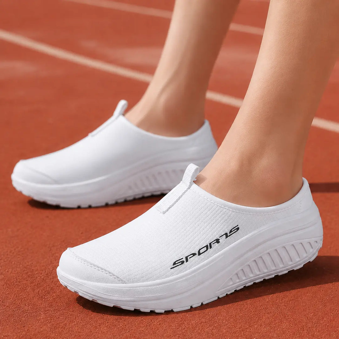 Women's comfortable slip-on house slippers with orthopedic arch support and breathable design.