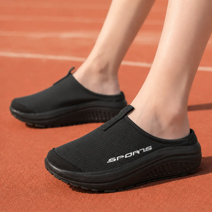 Relaxing women's closed-toe slip-on slippers, featuring orthopedic comfort for home use.