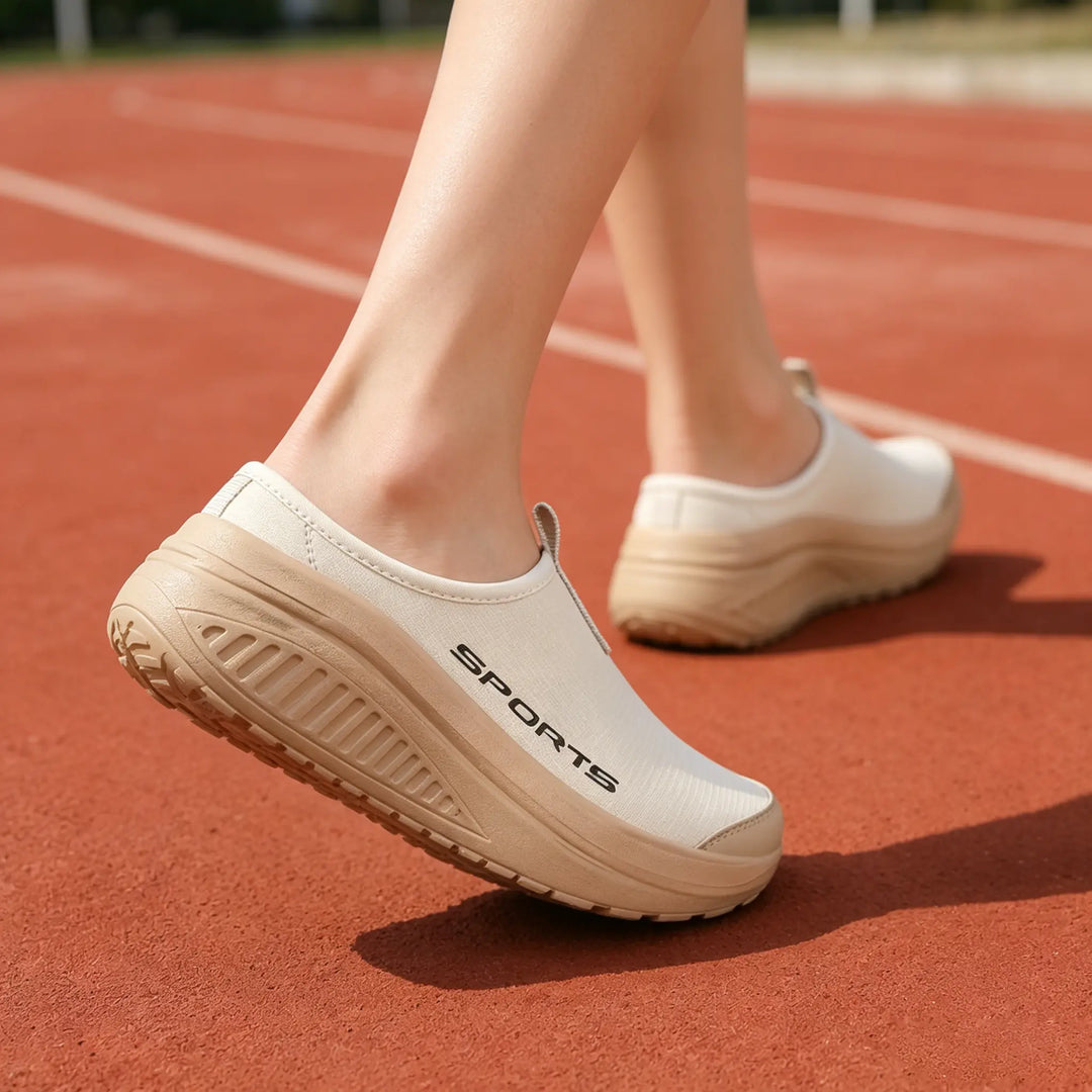 Lightweight slip-on women's house shoes, combining orthopedic features with breathable comfort.