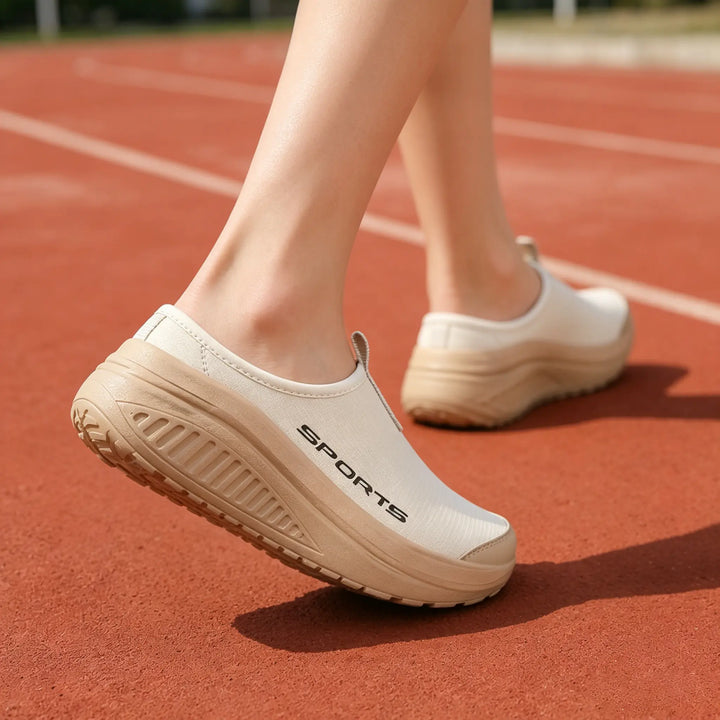 Lightweight slip-on women's house shoes, combining orthopedic features with breathable comfort.