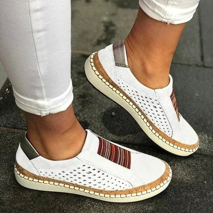 Stylish women's slip-on walking shoes. Versatile design with perforated detail, ideal for casual spring & summer wear.