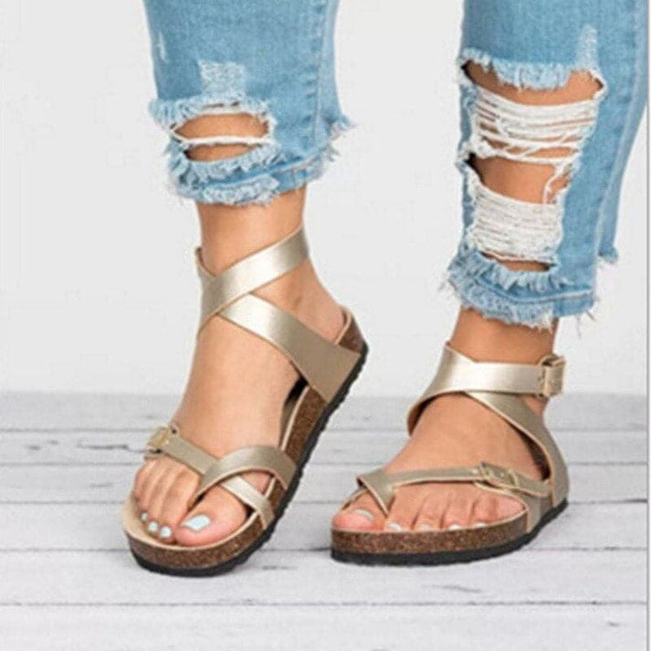 Durable women's open-toe strappy flat sandals with adjustable straps, offering stable and breathable comfort.