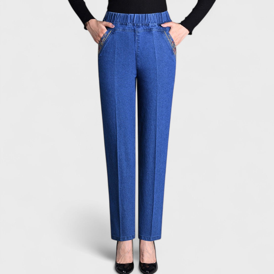 Women's comfortable stretch denim jeans with elastic waist, relaxed fit, and practical side pockets.