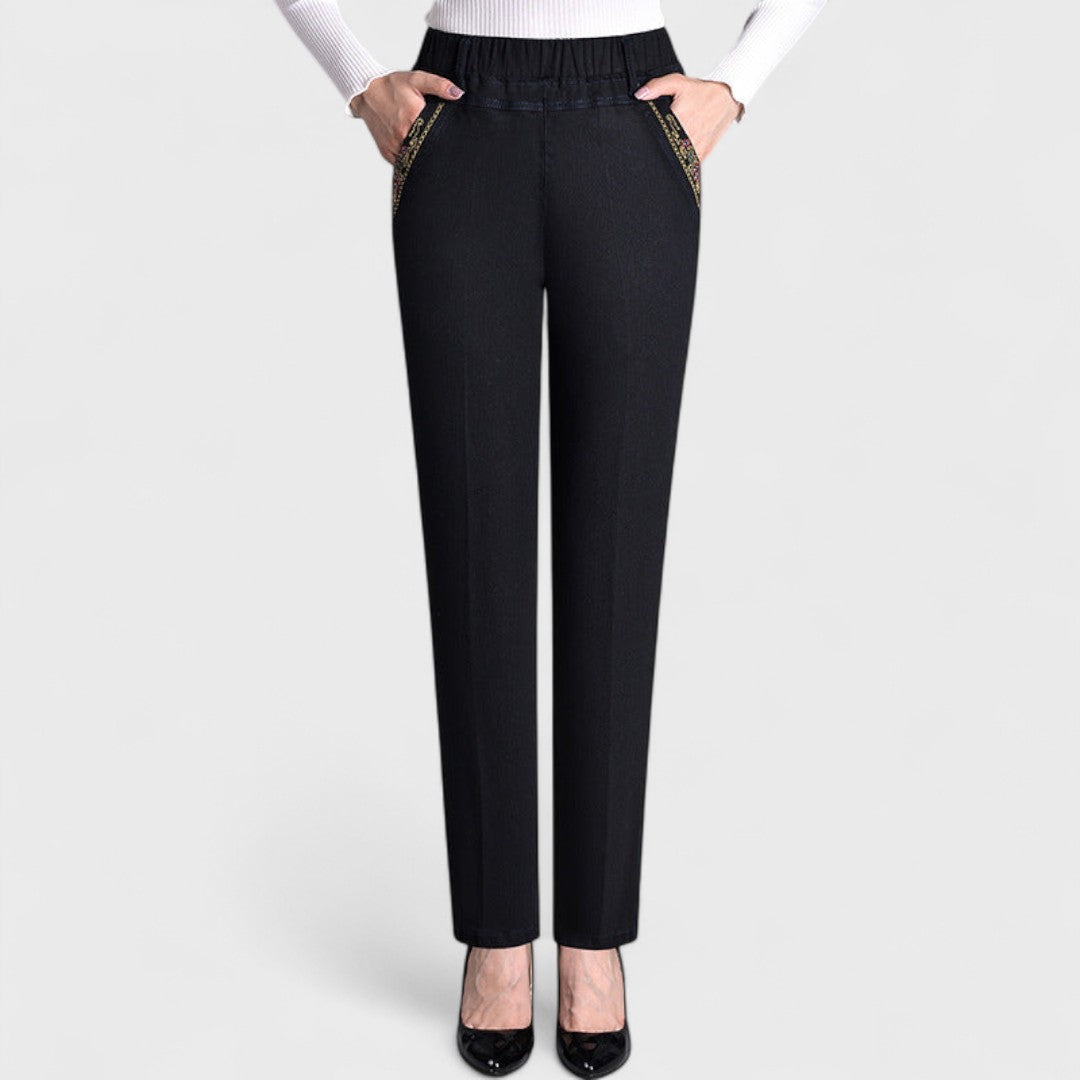Light blue women's stretch jeans with elastic waist & side pockets, perfect for casual, comfortable wear.