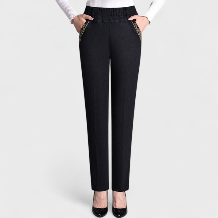 Light blue women's stretch jeans with elastic waist & side pockets, perfect for casual, comfortable wear.